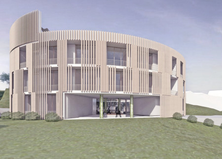 Circular Atrium Surrounded By Vertical Gardens Using Reinforced Concrete And Natural Stone For Enhanced Community Living