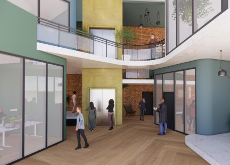 Charred Wood Cladding and Expansive Glass in a Versatile Community Workspace  