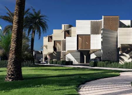 Curvilinear Form With Charred Wooden Shingles and Passive Solar Design for Community Gathering Spaces  