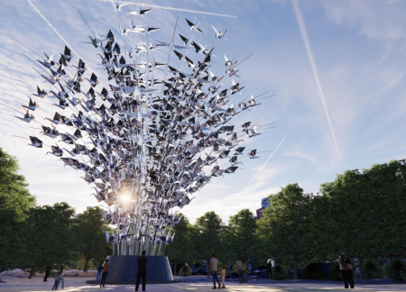 Reflective Stainless Steel Sculpture Anchored by a Robust Concrete Base in Urban Green Space