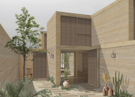 Residential home prioritizing sustainability with rammed earth walls and natural wood elements