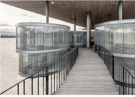 Charred Wooden Shingles and Living Walls in a Community-Oriented Urban Hub