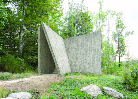 Textured Concrete Pathway Integrating Natural Light and Sacred Space  