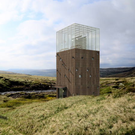 Charred Wooden Shingles and Natural Light Create Engaging Community Spaces