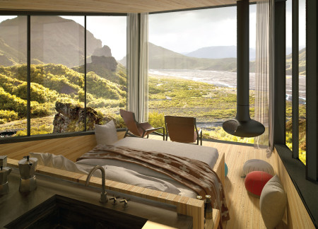 Charred Wood Exterior and Elevated Form Integrating Into Icelandic Terrain