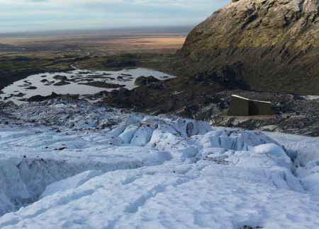 Charred Timber and Lava Stone Cabin Embracing Panoramic Icelandic Vistas  