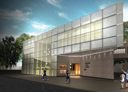 Educational facility integrating perforated aluminum and masonry in an urban landscape