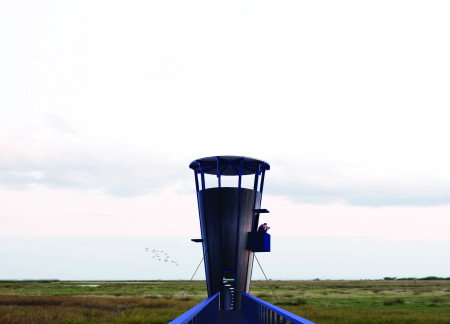 Conical Observation Tower Designed With Steel Framework and Transparent Panels Overlooking Wetland Habitat