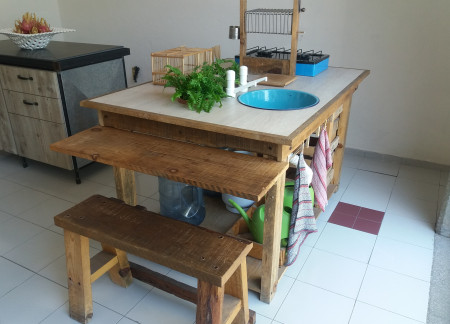 Reclaimed Wood and Ceramic Accents in a Versatile Kitchen Space  