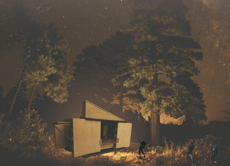 Dynamic Cabins with Pivoting Walls Constructed of Engineered Timber and Glass in a Forest Setting