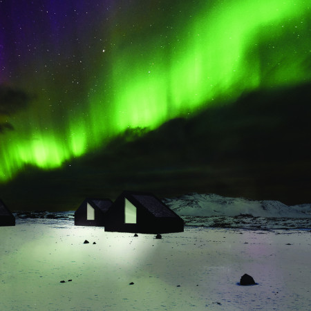 Charred Wooden Shingles and Timber Panels Creating a Secluded Retreat for Aurora Observation