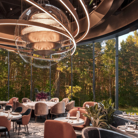 Cultural Center Showcasing Cross-Laminated Timber and Charred Wood Shingles in an Engaging Natural Landscape