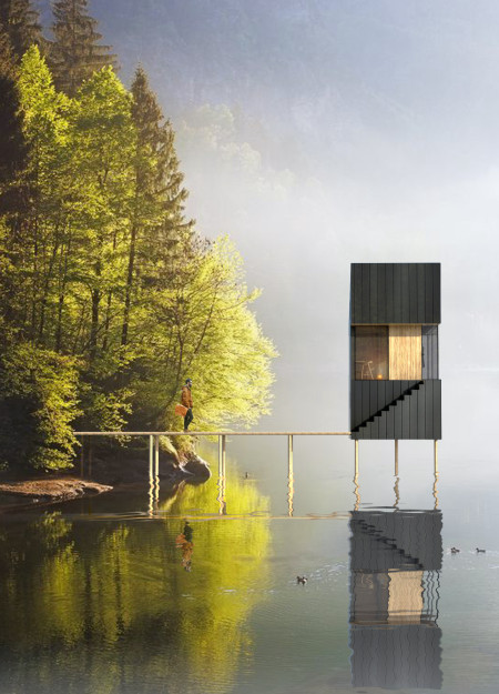 Residential retreat featuring cross-laminated timber panels and charred wooden shingles in natural harmony with the landscape