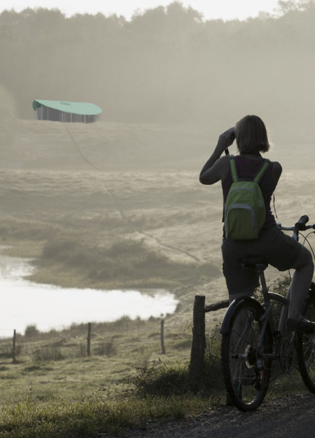 Charred Wooden Shingles and Solar Panels Frame Sustainable Cyclist Shelters  
