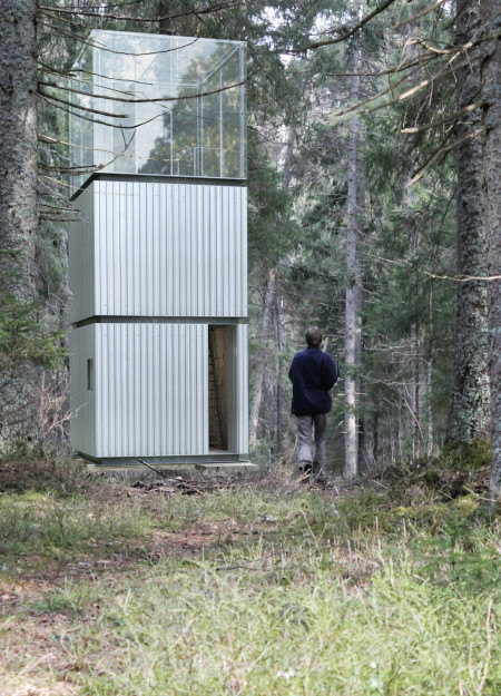 Vertical Retreat Crafted from Corrugated Metal and Plywood Nestled within Nature's Canopy