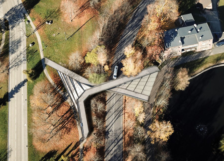 Organic Form Crafted in Concrete and Polymer Integration Within Natural Landscape  