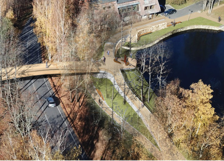 Parabolic Steel Cords and Thermally Treated Timber Integrated Into a Biophilic Footbridge in a National Park  