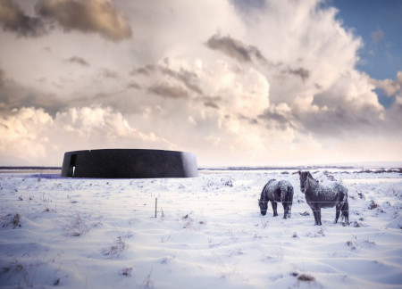 Circular Structure Crafted From Local Basalt and Black Concrete Reflecting Iceland's Geological Heritage  