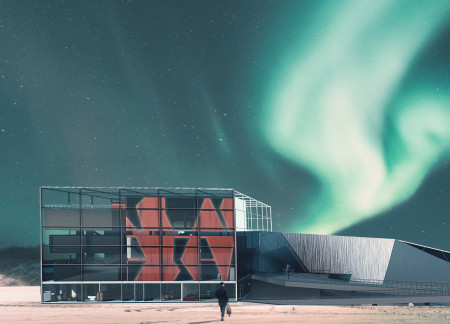 Translucent Glass Facade and Charred Wooden Shingles Define A Cultural Hub In Iceland