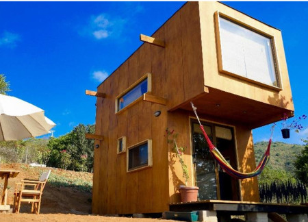 Elevated Terrace Crafted from Marine Plywood and Impregnated Wood for Compact Living  