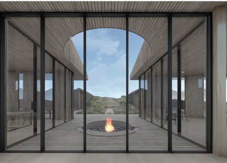 Curvilinear Cabins Crafted from Natural Stone and Cedar in a Volcanic Landscape  