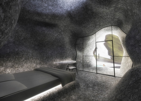 Curvilinear Design Showcasing Local Stone and Reinforced Glass in a Sustainable Retreat