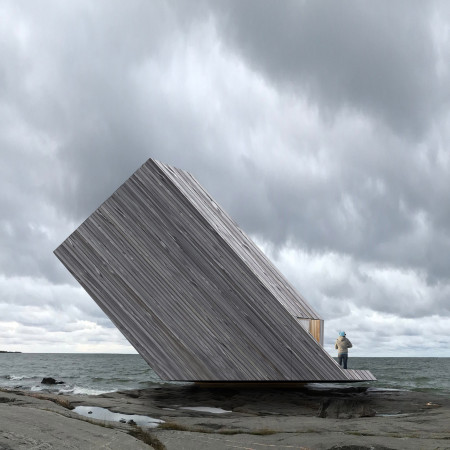 Transformable Living Space Constructed With Treated Wood and Solar Panel Integration
