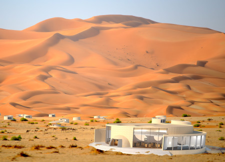 Compressed Sand Structures Blending Circular Lodges with Sustainable Materials in a Desert Retreat