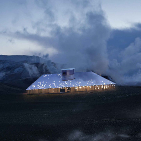 Community Gathering Space Emphasizing Natural Stone and Photovoltaic Glass in a Volcanic Landscape