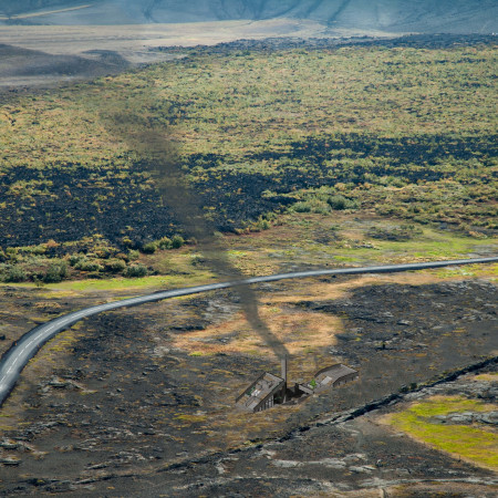 Geothermal Visitor Center With Basalt Integration and Natural Wood Elements  