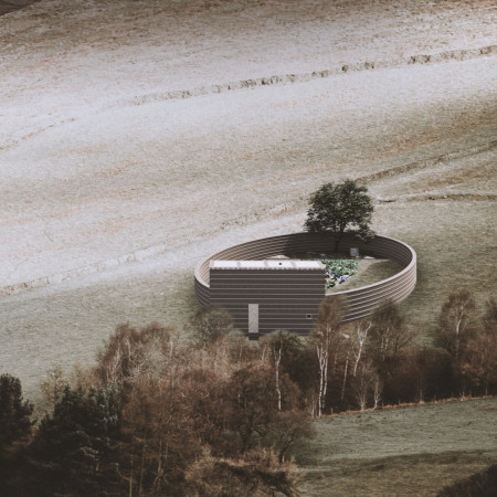 Rammed Earth Walls and a Community-Centric Garden in a Circular Form Home  