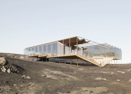 Elevated Structure of Galvanized Steel and Glass Embracing Sustainable Practices in a Volcanic Landscape