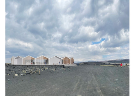 Circular Structure Embracing Volcanic Landscape With Corrugated Metal and Natural Wood Finishes