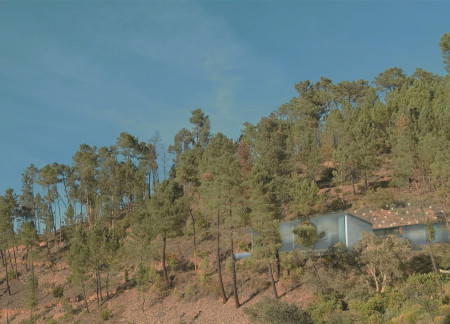 Rammed Earth Wellness Retreat Embracing Natural Elements in a Hillside Setting  