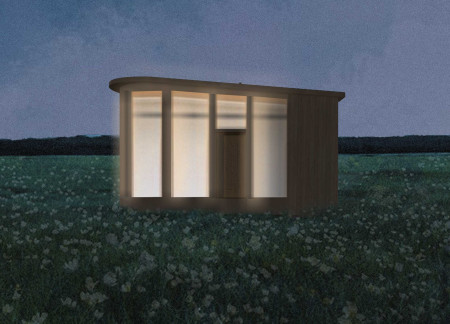 Charred Wooden Shingles Complement Curved Structure in A Tranquil Microhome Design