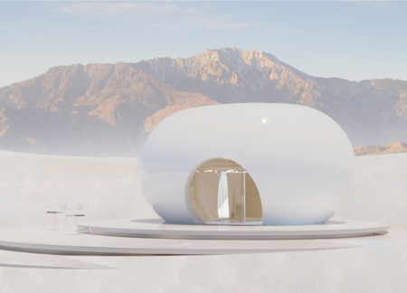Eco-friendly home featuring a 3D printed carbon-fiber shell and passive design in a desert setting  