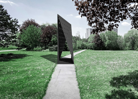 Reflective Steel and Geometric Form in a Contemplative Memorial Space