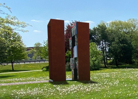 Reflective Steel Panels and Community Engagement Shape a Memorial for Collective Remembrance