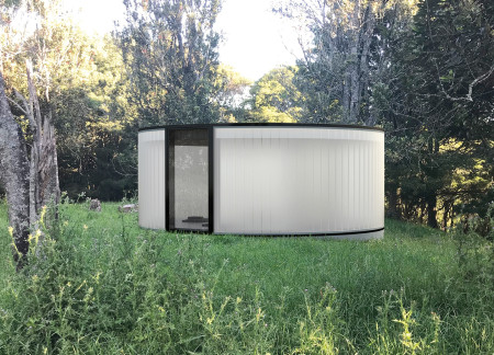 Cocoon-Like Retreat Featuring Locally Sourced Slate and Transparent Glass for Mindful Connection with Nature