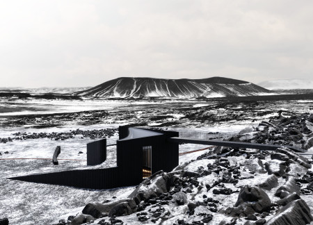 Curvilinear Footbridge Utilizing Reinforced Concrete and Treated Wood for Seamless Integration With Iceland's Tectonic Landscape