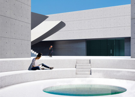 High Concrete Walls Framing Secluded Relaxation Amidst an Artificial Microclimate