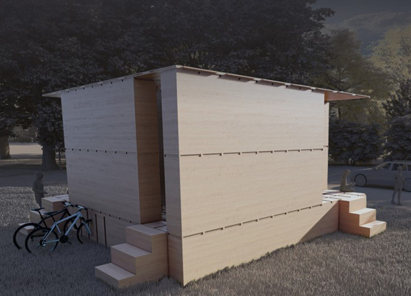 Charred Wooden Shingles Complementing Cross-Laminated Timber Panels In A Flexible Reading Space  