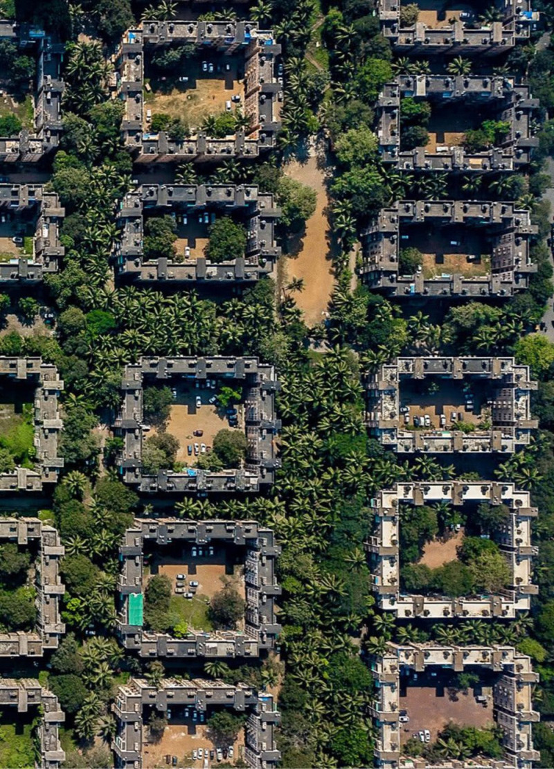 Charred Wooden Shingles and Glass Facades Forming A Sustainable Community Hub  