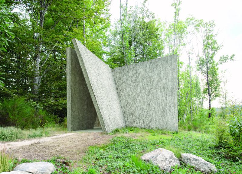 Textured Concrete Pathway Integrating Natural Light and Sacred Space  