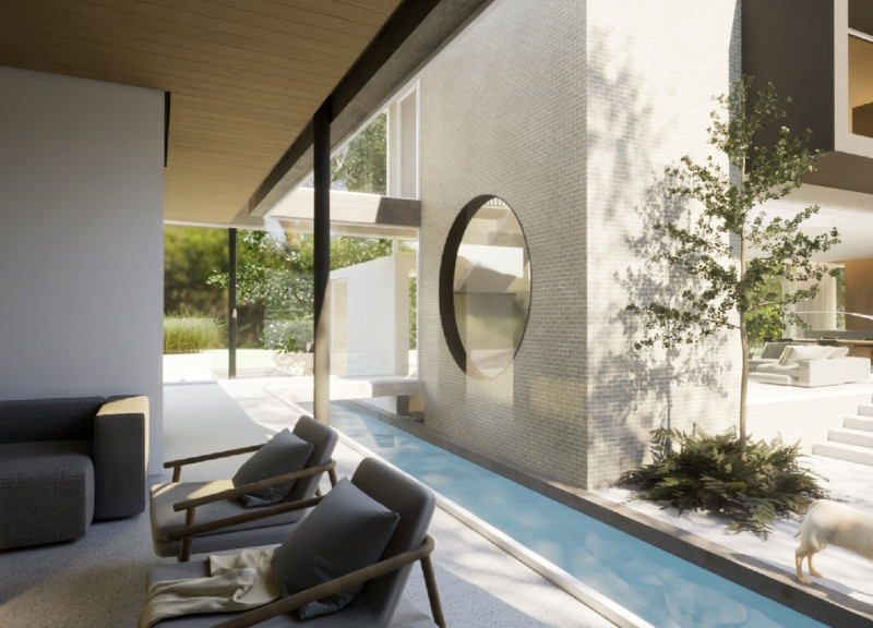 Circular Apertures and Natural Light Enhancements in a Concrete and Glass Residence  