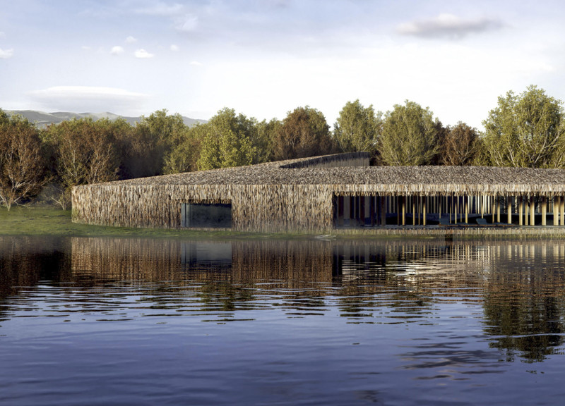 Earth-Toned Sanctuary Featuring Blue Clay Walls and Straw Roof in a Natural Retreat Setting