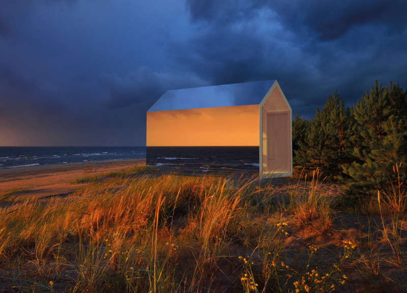 Reflective Aluminum Cabins Merging Timber Warmth with Coastal Serenity