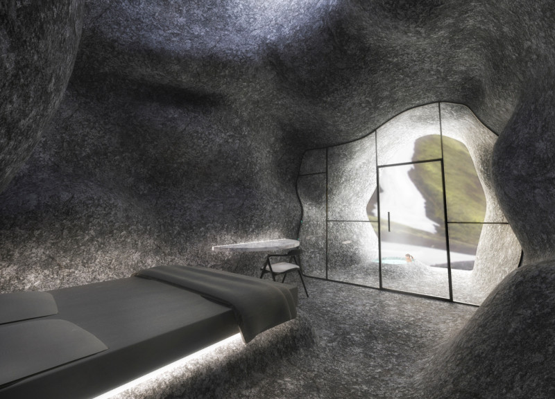 Curvilinear Design Showcasing Local Stone and Reinforced Glass in a Sustainable Retreat