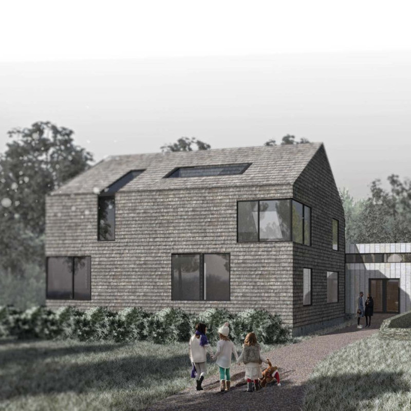 Artists' residency featuring reclaimed cedar wood and a green roof system nestled by a tranquil lakeside.