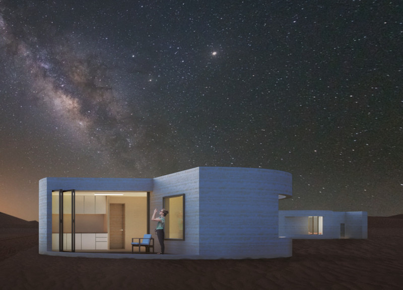 Circular Lodge Featuring Sandstone And Photovoltaic Panels in Desert Landscape